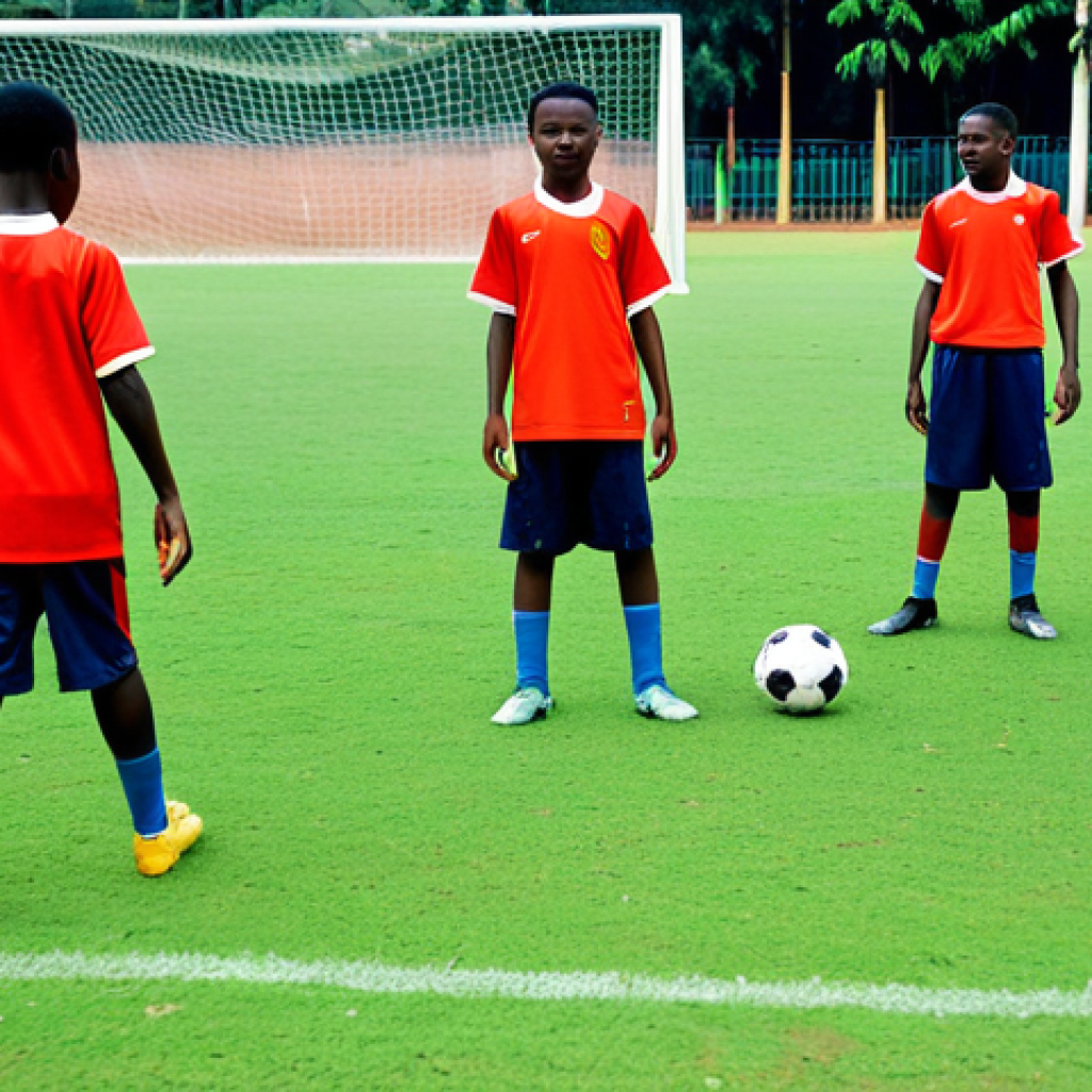Youth Academy Training Session**

"A group of young, fully clothed football players in matching modest training gear are practicing drills on a well-maintained grass field at a modern training facility in Yaound&eacute;, Cameroon, appropriate content, safe for work, perfect anatomy, correct proportions, natural pose, professional photography, high quality, dynamic action shot, clear sunny day."

**